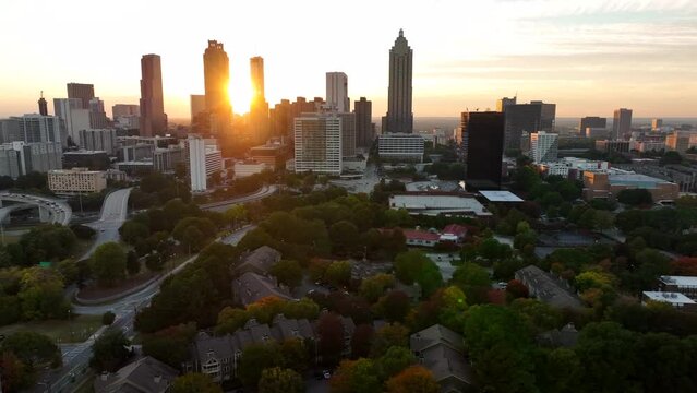 Aerial of Atlanta Georgia skyline at sunset. Beautiful light among skyscrapers. Truck shot.