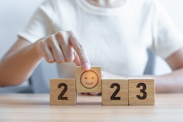 Smile face with 2023 block.  Satisfaction, feedback, Review, mental health, eco sustainable and...