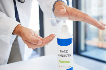 Fototapeta premium Doctor, hands and sanitizer for hygiene protection against virus, disease or bacteria at the workplace. Hand of healthcare professional using sanitary equipment for medical wellness and clean safety