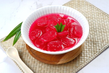 manisan kolang kaling ,preserved sugar palm fruit,tinted red with red syrup and paste  .an indonesian typical refreshment and dessert during ramadan month and hari raya idul fitri