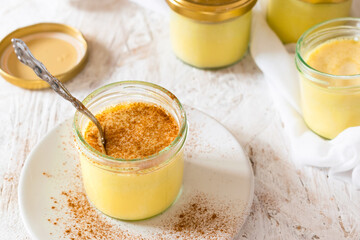 Sous vide vanilla custard, paleo custard with cinnamon on a white background.