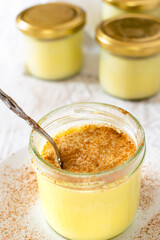 Sous vide vanilla custard, paleo custard with cinnamon on a white background.