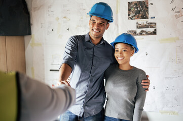 Handshake, construction and couple consulting, planning and doing inspection of home renovation with a contractor. Meeting, thank you and man and woman shaking hands with an architect in their house