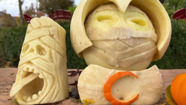 art carving of vegetables and fruits Carved different characters and faces on a pumpkin Halloween decorations for autumn harvest festivals Interesting creative ideas Table decorations and building