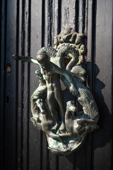 Fascinating art installation on one of the entrance doors to the historic Villa Monastero, the villa of lords, Varenna, Province of Lecco, Italy.