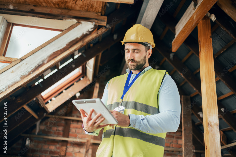 Poster Tablet, construction and building with a man engineer working online on a building site from below. Construction worker, architect and industry with a male technician planning design while at work