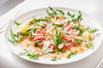salmon carpaccio with capers and lemon