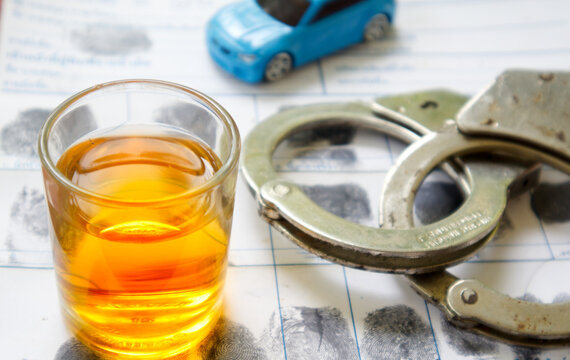 drink drive concept.glass of whiskey on police fingerprint crime page file.