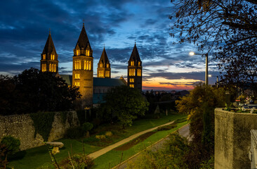 Four towers of christian cathedral at night in Pecs, Hungary