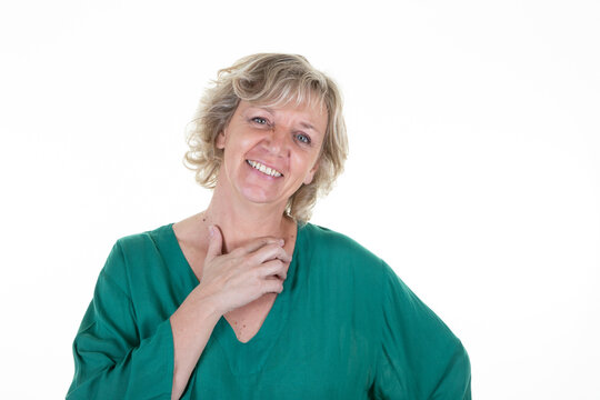 Portrait of blond mature woman on white background