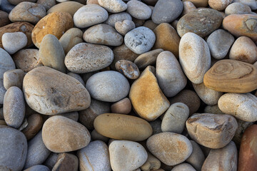 Pebble stone over the sea beach background