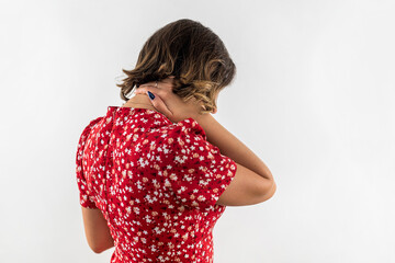 Young beautiful brunette with neck pain holding neck isolated on white background.