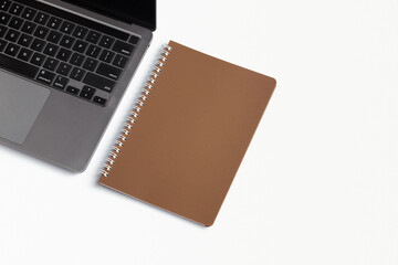 School notebook on a white background, spiral notepad on a table. flatlay