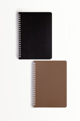 School notebook on a white background, spiral notepad on a table. flatlay