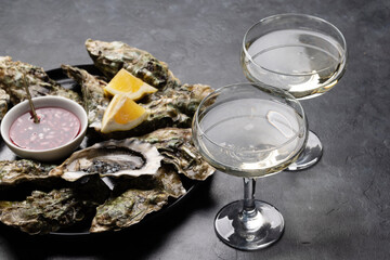 Fresh oysters with glasses of sparkling wine