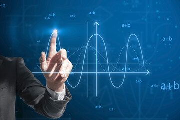 Close up of businessman finger pointing at abstract glowing mathematical formula graph on blue background. Equation, digital data and mathematics app concept.