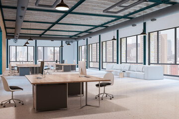 Perspective view sunlit open space office with loft style interior design, wooden tables, white sofa on light concrete floor and city skyline view from panoramic windows. 3D rendering