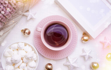 Obraz na płótnie Canvas Winter, Christmas, New Year decoration composition, concept, background. White Mug, cup of hot tea, coffee, meringue, knitted plaid. Christmas lights. Christmas mood morning. Christmas greeting card.