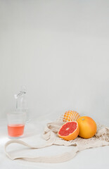 Grapefruits and drinking water in fabric, minimal scandinavian theme