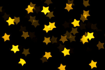 Golden holiday glowing backdrop. Defocused bokeh background