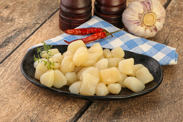 Raw scallop seafood in the bowl