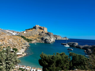 Aerial view of the famouse tourist destination in rhodes island. Village Lindos, with the acropolis...