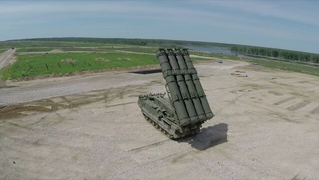 flying over missile launcher and tanks