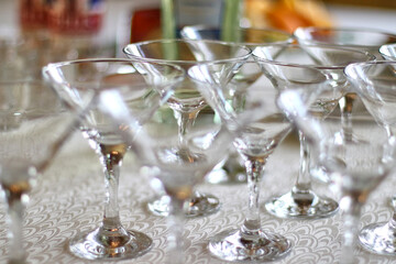 Cocktail glasses are displayed on the buffet table.