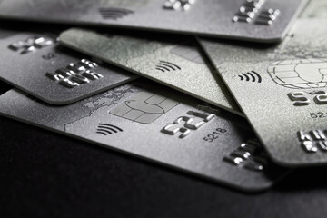 Close-up of a group of bank credit cards on dark background