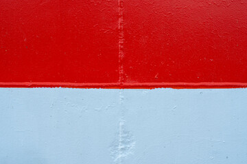 Metal sheet painted in white and red. Background in the colors of the flag of Poland.