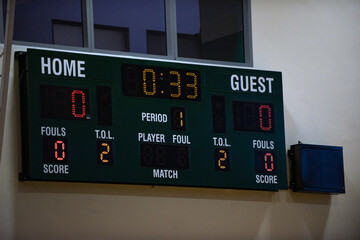 Digital indoor main scoreboard for a volleyball tournament in a gymnasium. Seeing a game about to...