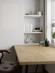 Fototapeta na wymiar Minimal Scandinavian home workspace with copy space on minimal wood table, blank poster on wall