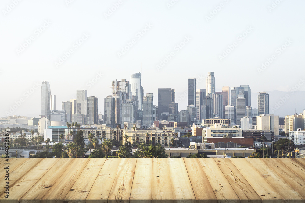 Wall mural Wooden tabletop with beautiful Los Angeles buildings on background, mock up