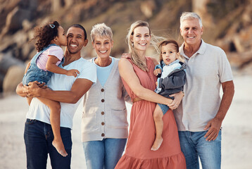 Interracial family, beach smile and children together on a bonding with happiness and kid care. Portrait of a happy, vacation and parents with senior grandparents holding kids with love outdoor