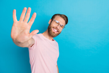 Photo portrait of attractive young man smart businessman wave arms smile wear trendy pink clothes...