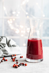 Homemade cranberry sauce with whole cranberries, a classic side dish for Thanksgiving and Christmas. Traditional holiday food served as a sweet and tangy condiment.