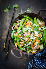 Healthy stir fry with snap peas and chicken