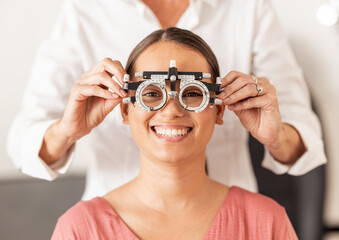 Eye test, vision and optometry with a woman customer testing her eyes during an optician appointment. Insurance, consulting and glasses with a female patient in an exam for prescription lenses