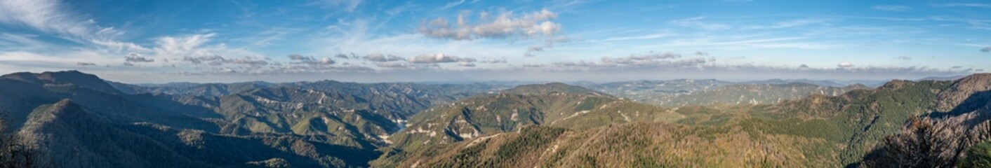 Fototapeta premium Panoramic view from the top of Monte Penna, on the surrounding mountains, between Tuscany and Emilia Romagna, Italy, between Badia Prataglia and the hermitage of Camaldoli