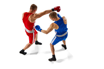 Fototapeta na wymiar Battle of two boxers. Two muscular professional boxers in blue and red sportswear training isolated on white background. Aerial view