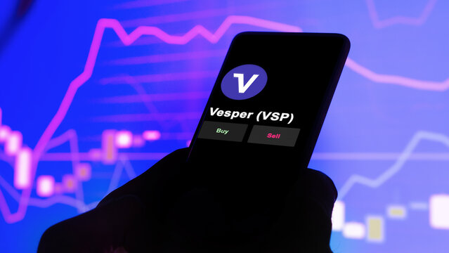 November 3th 2022. An investor's analyzing the Vesper token 'VSP' coin on screen. A phone shows the vesper crypto 's prices to invest