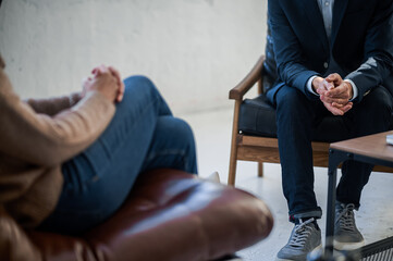 Man and woman sitting opposite each other and talking