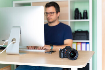 Photographer in his office working on the computer