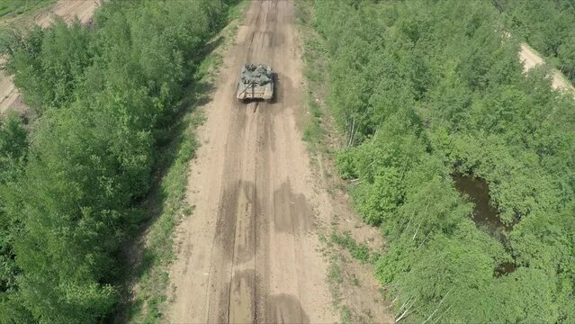 flying over the tank in rough wooded country