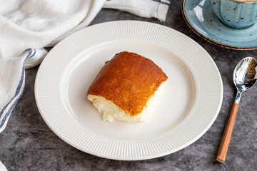 Kazandibi dessert on a dark background. Milky dessert. Traditional Turkish cuisine delicacies. close up
