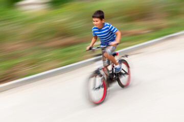 Fototapeta premium boy riding a bike