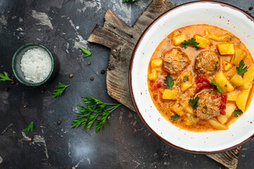 stew vegetables with meatballs on a dark background, Delicious balanced food concept, place for text, top view