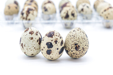 Obraz premium quail eggs on white background
