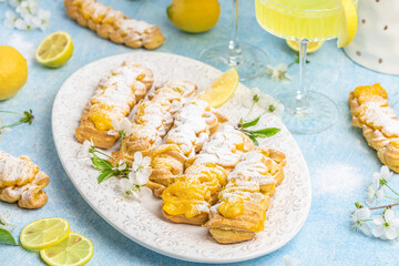 Traditional italian homemade lemon alcohol drink liqueur limoncello with pieces of lemon and...
