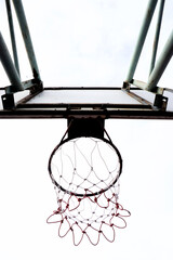 Basketball hoop close up shot with white sky background